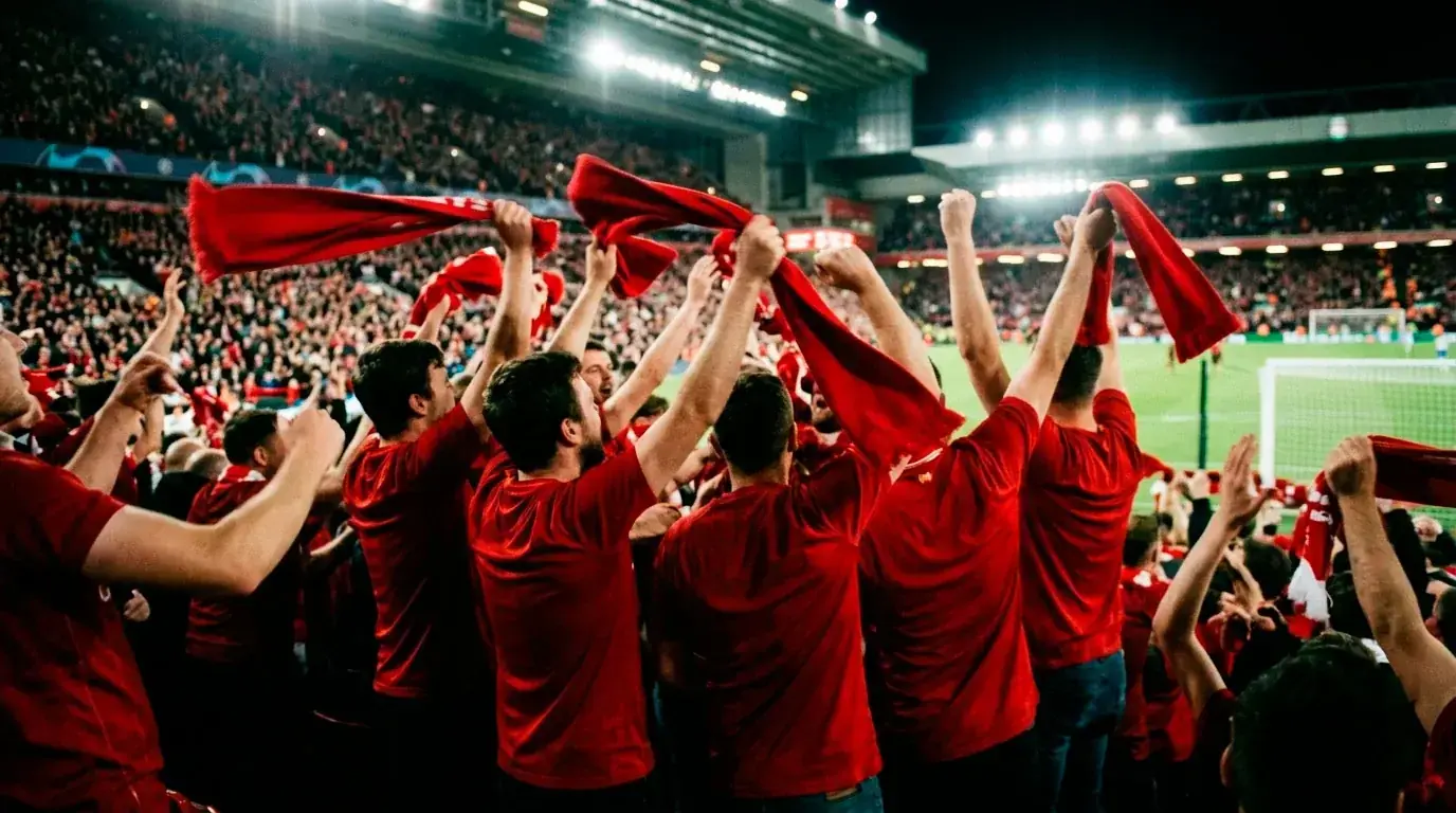 Football fans celebrating wildly in red under stadium floodlights at the 2026 World Cup